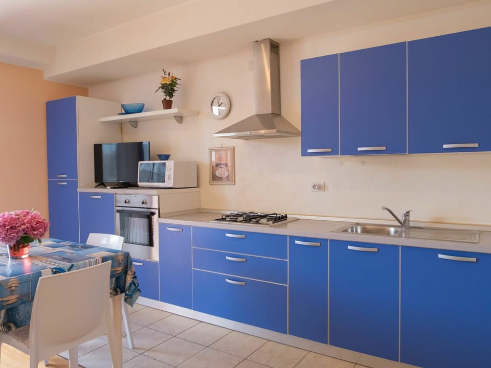 Cabinetry, Furniture, Countertop, Property, Kitchen Sink, Tap, Blue, Sink, Building, Kitchen Stove