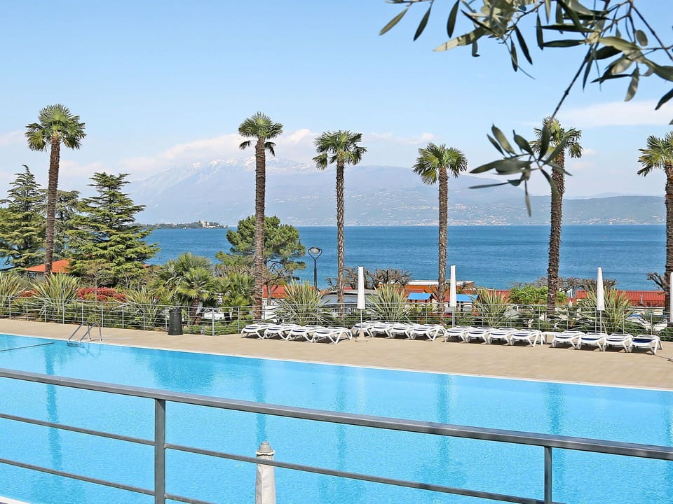 Water, Sky, Plant, Azure, Tree, Shade, Swimming Pool, Arecales, Seaside Resort, Coastal And Oceanic Landforms