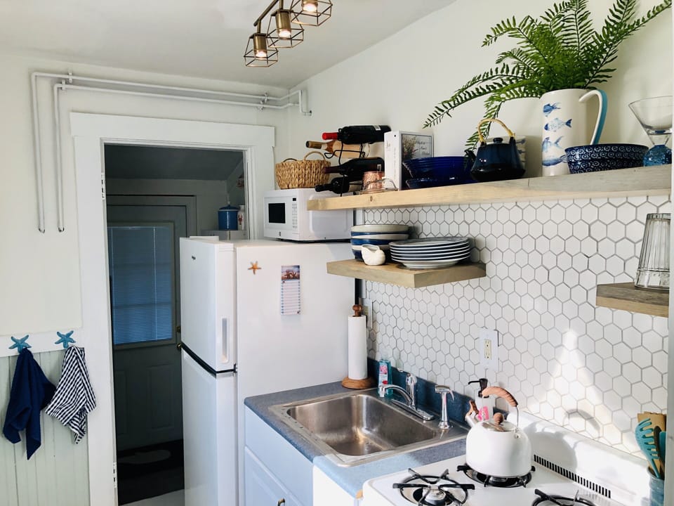 This galley kitchen has everything you need . Gas grill is also out back.
