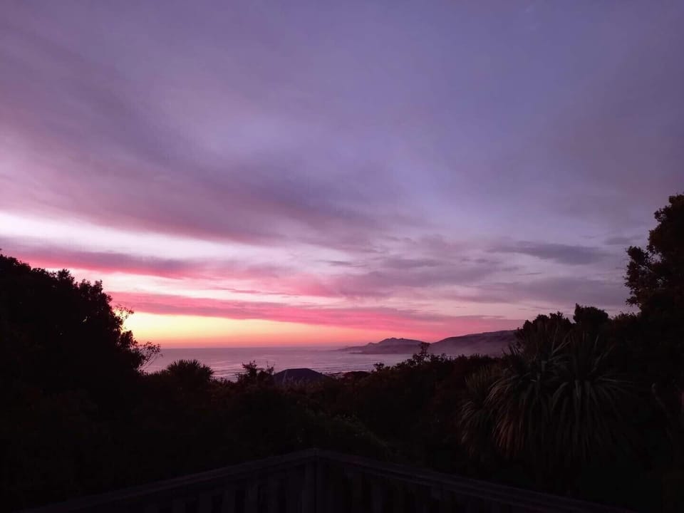 View from the deck. Sunrise over nugget point (taken by one of our guests)