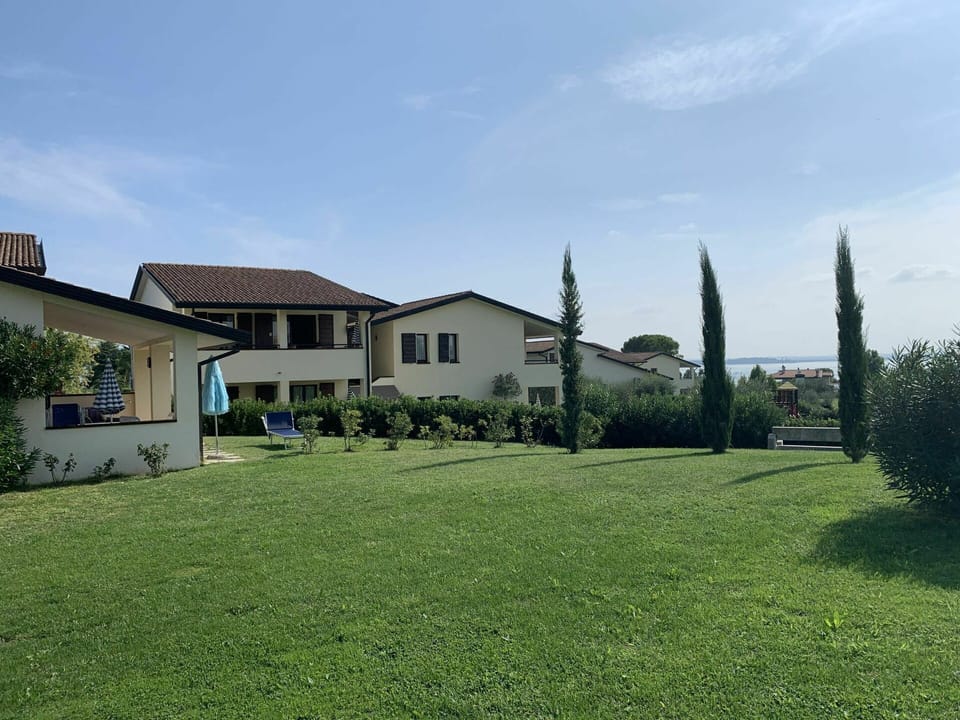 Sky, Plant, Cloud, Building, Window, Tree, Land Lot, Vegetation, Natural Landscape, House