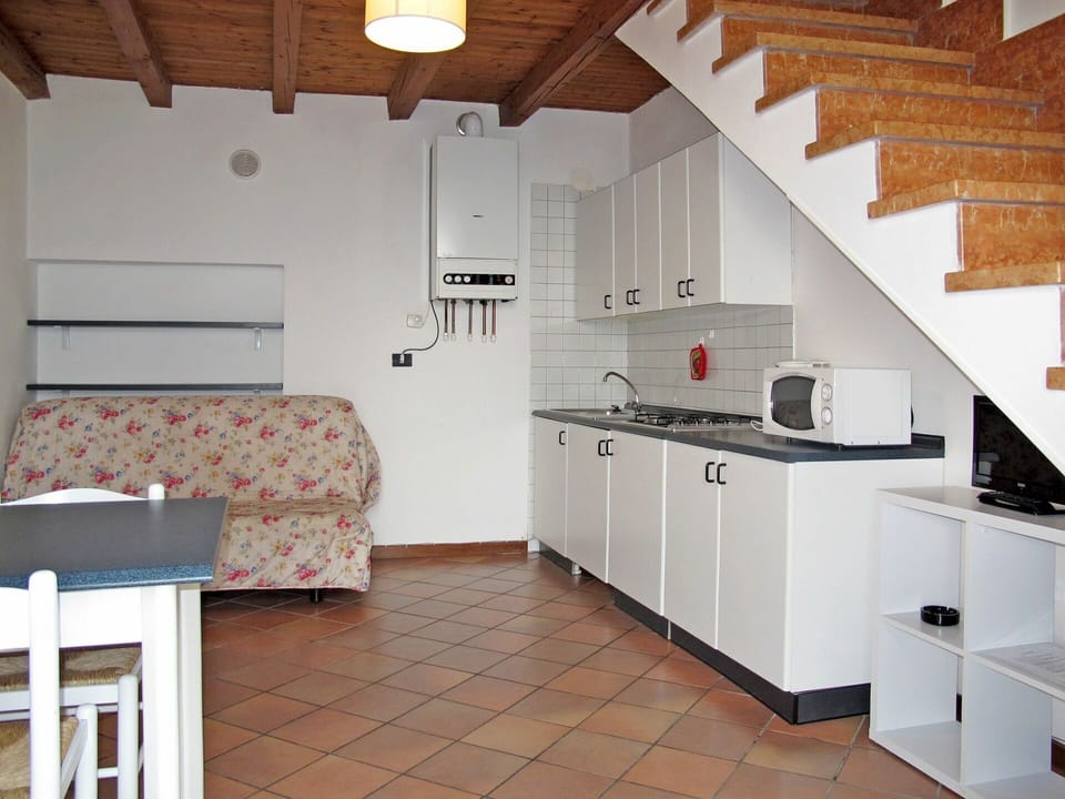 Cabinetry, Property, Countertop, Building, Sink, Wood, Kitchen Stove, Lighting, Interior Design, Window