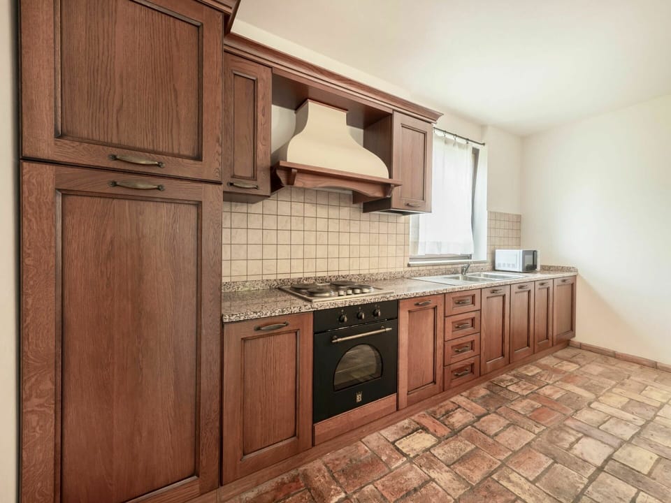 Brown, Cabinetry, Property, Countertop, Kitchen Stove, Building, Kitchen Appliance, Sink, Wood, Stove