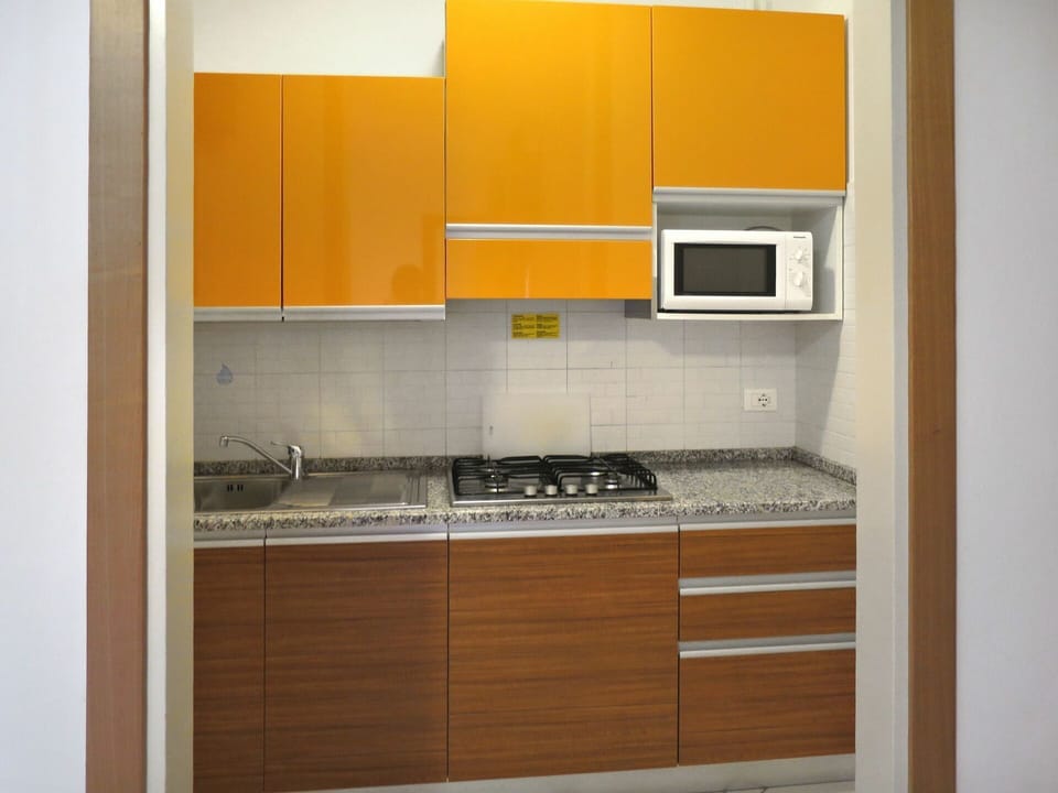 Furniture, Room, Cabinetry, Property, Countertop, Kitchen, Cupboard, Yellow, Orange, Interior Design