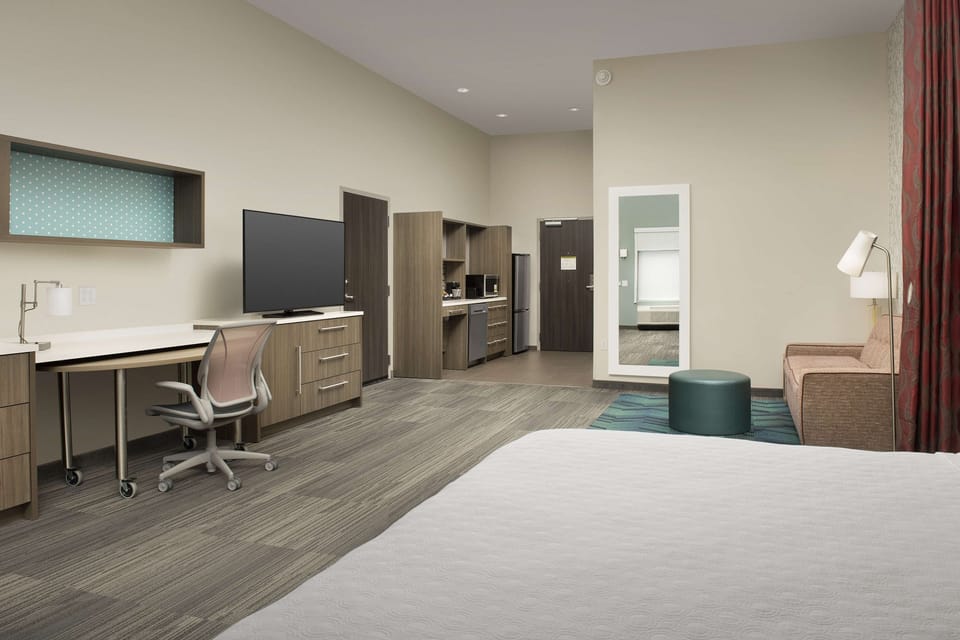 Studio, 1 King Bed, Accessible (Roll-In Shower) | Desk, laptop workspace, blackout drapes, iron/ironing board