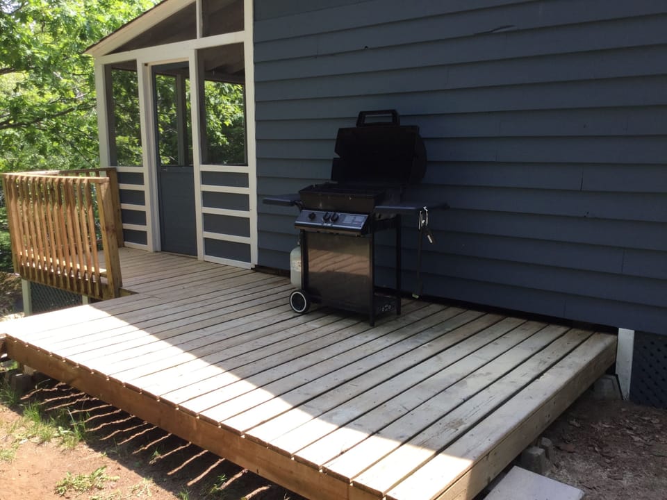 The BBQ deck and entrance to the screened in porch. 