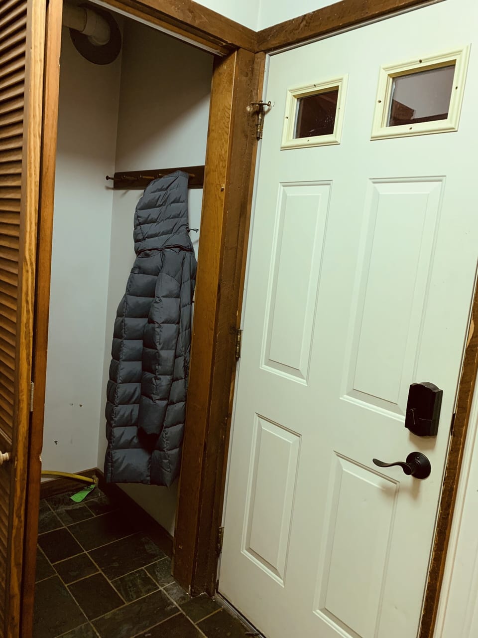 Entry way closet. Hooks to hang jackets and where hot water heater is located 