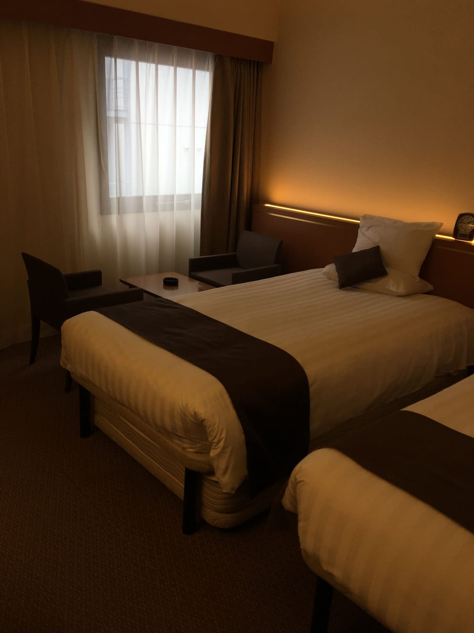 Desk, blackout drapes, bed sheets