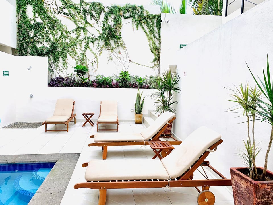Outdoor shower and lounge chairs available.