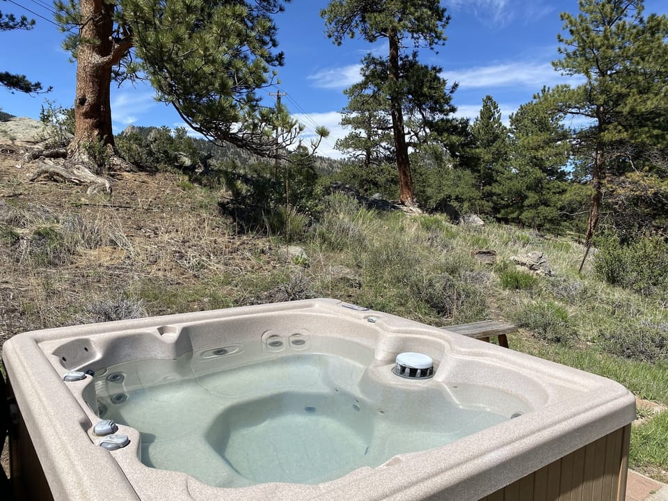 Shared hot tub surrounded by wilderness