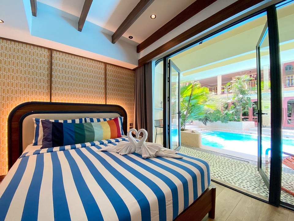 Deluxe Pool Access Room | In-room safe, blackout drapes, free WiFi, bed sheets