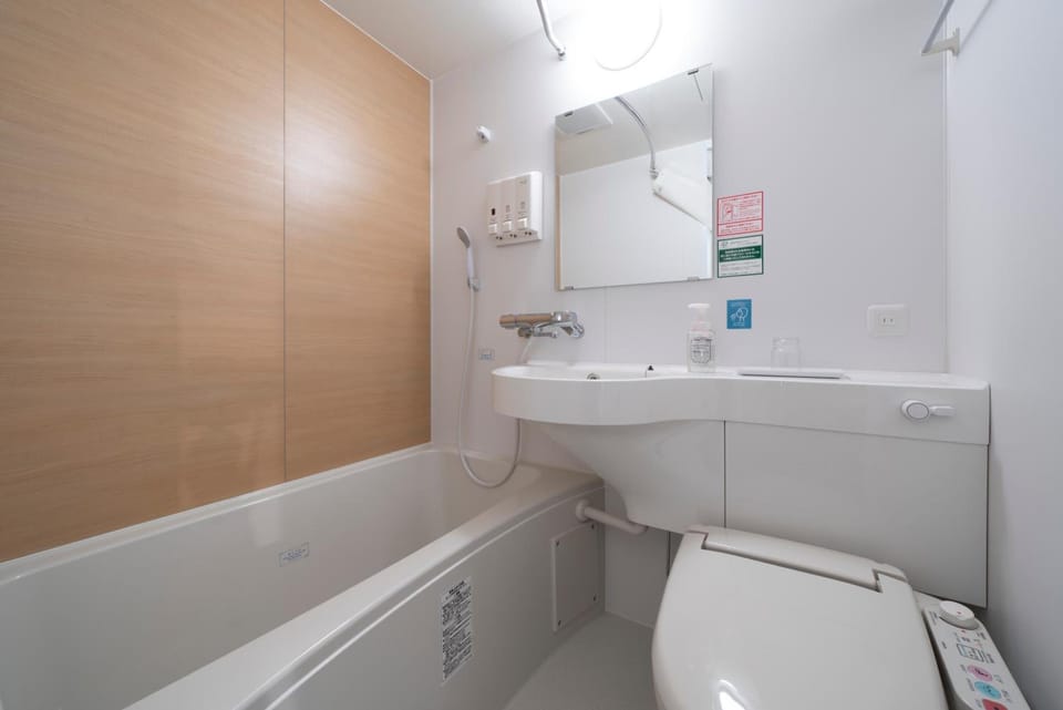 Combined shower/tub, hair dryer, slippers, electronic bidet