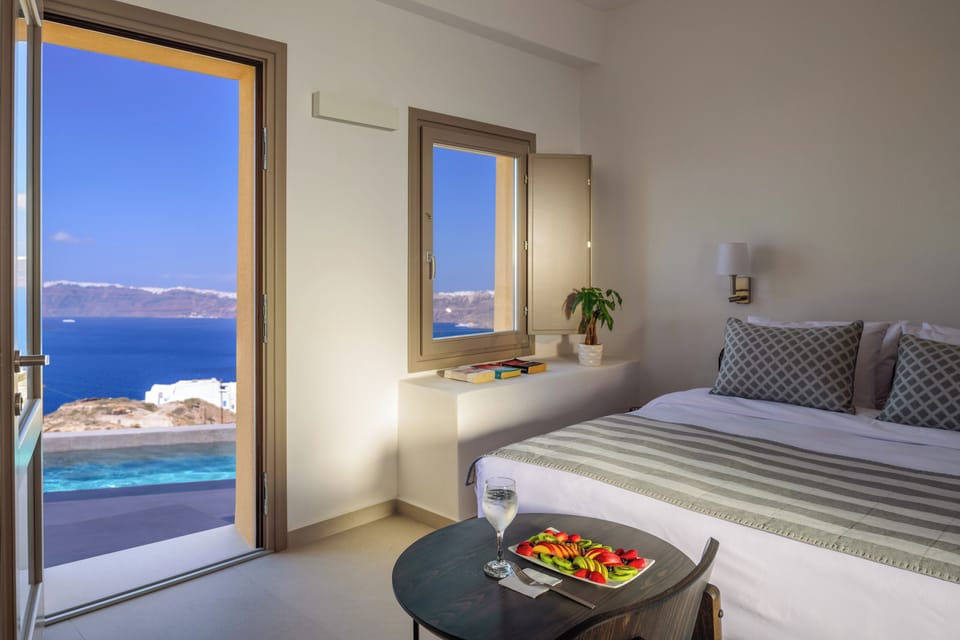 Elegant Double Room with Caldera View | Minibar, in-room safe, soundproofing, iron/ironing board