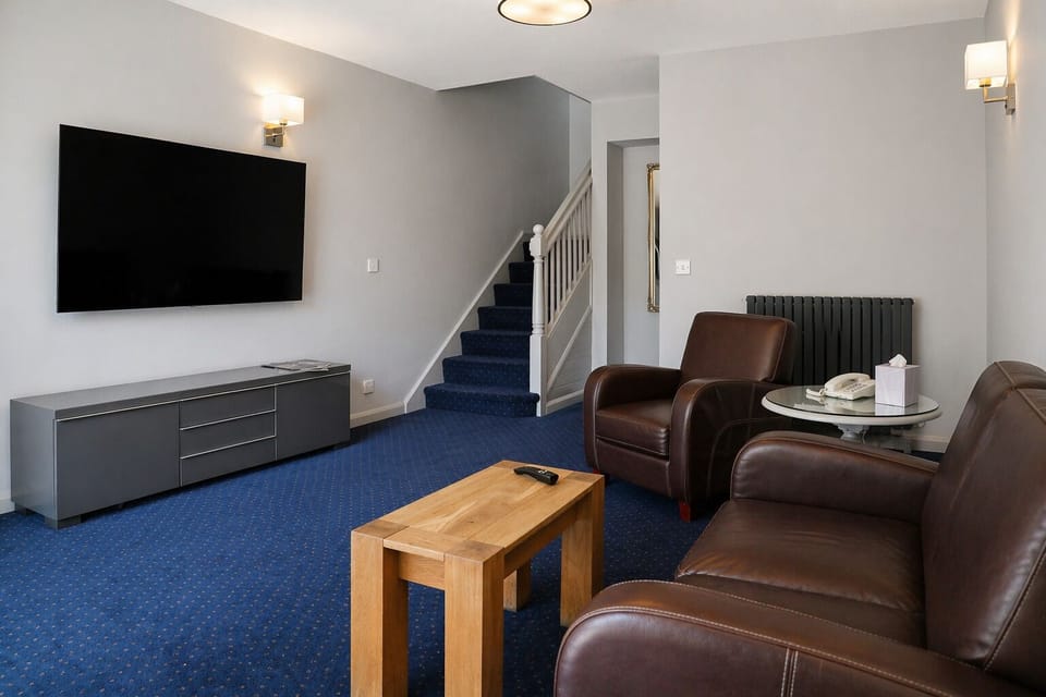 Superior Suite, 1 Bedroom, Mezzanine | Desk, iron/ironing board, free WiFi, bed sheets