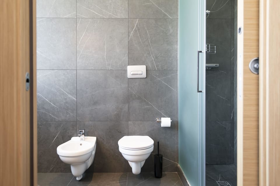 Superior Twin Room | Bathroom | Rainfall showerhead, hair dryer, bidet, towels