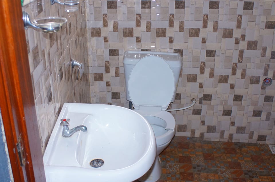 Shower, rainfall showerhead, towels, soap