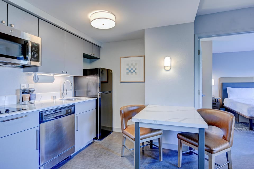 Suite, 1 King Bed, Non Smoking | Private kitchen | Full-size fridge, microwave, stovetop, coffee/tea maker