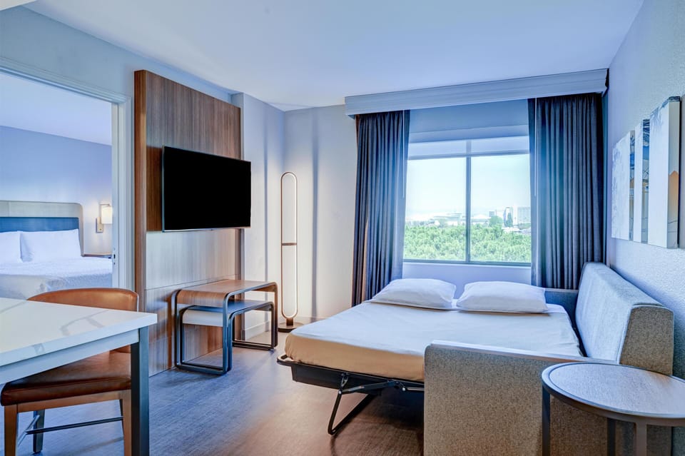 Individually furnished, desk, laptop workspace, iron/ironing board