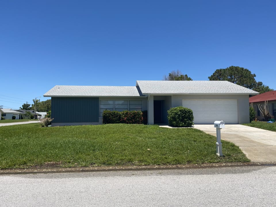 Large corner lot with double wide driveway and oversized garage