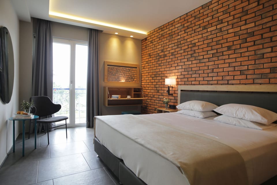 Superior Room, Partial Sea View | Select Comfort beds, in-room safe, desk, laptop workspace