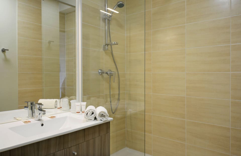Get ready for your day in the lovely bathroom.