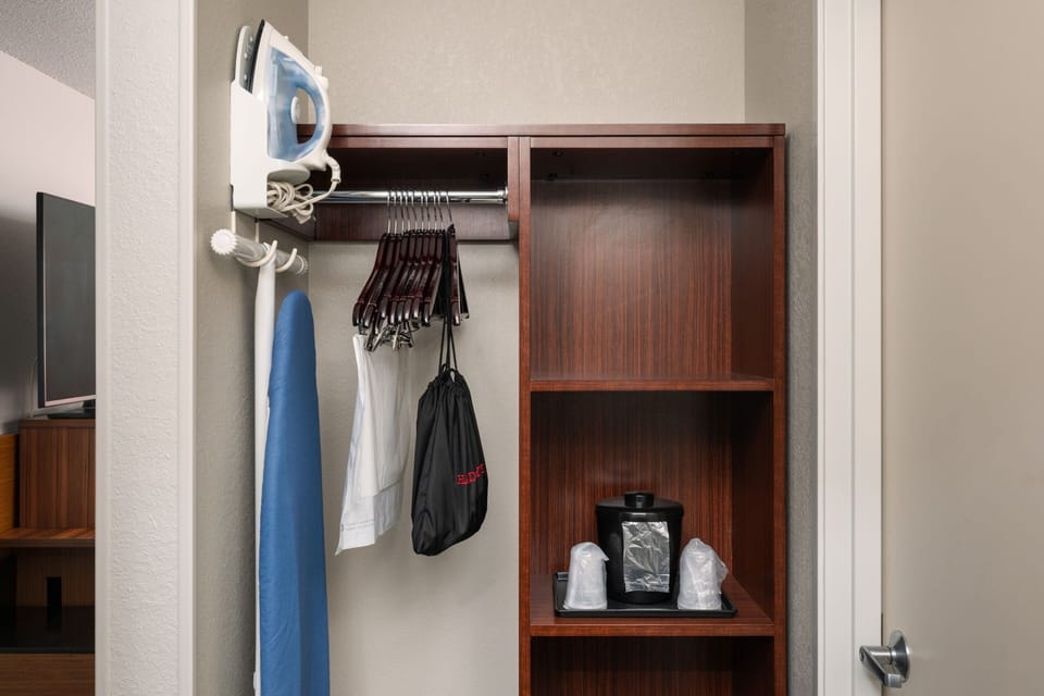 Desk, laptop workspace, blackout drapes, iron/ironing board