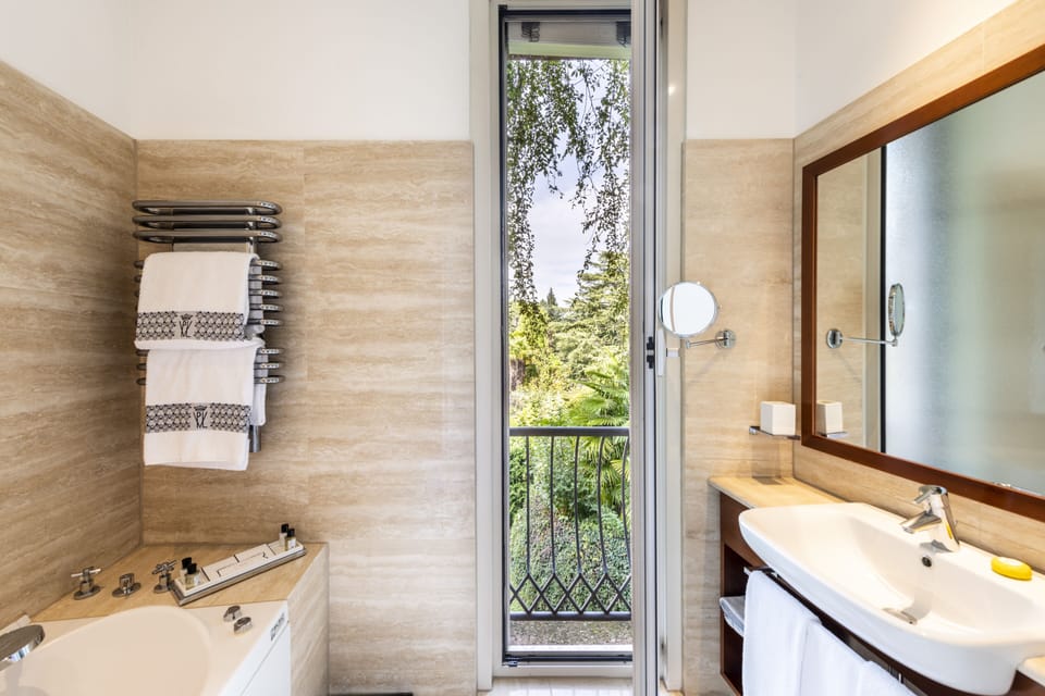 Designer toiletries, hair dryer, bathrobes, slippers