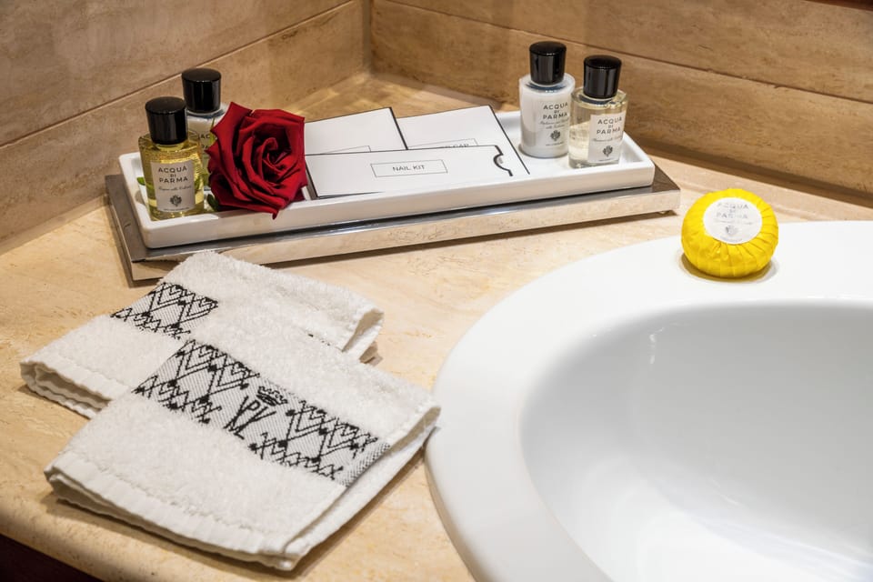 Designer toiletries, hair dryer, bathrobes, slippers