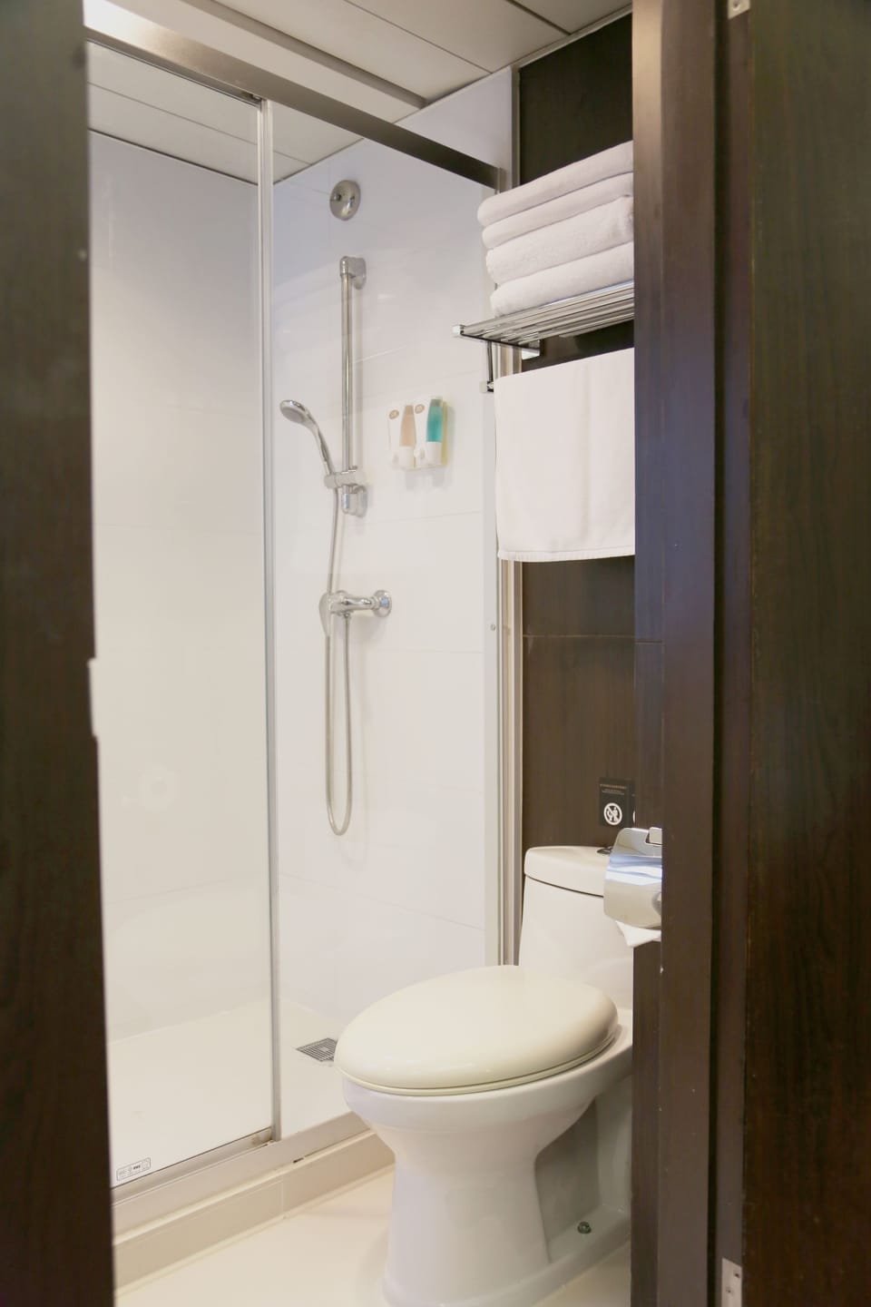 Shower, hair dryer, slippers, towels