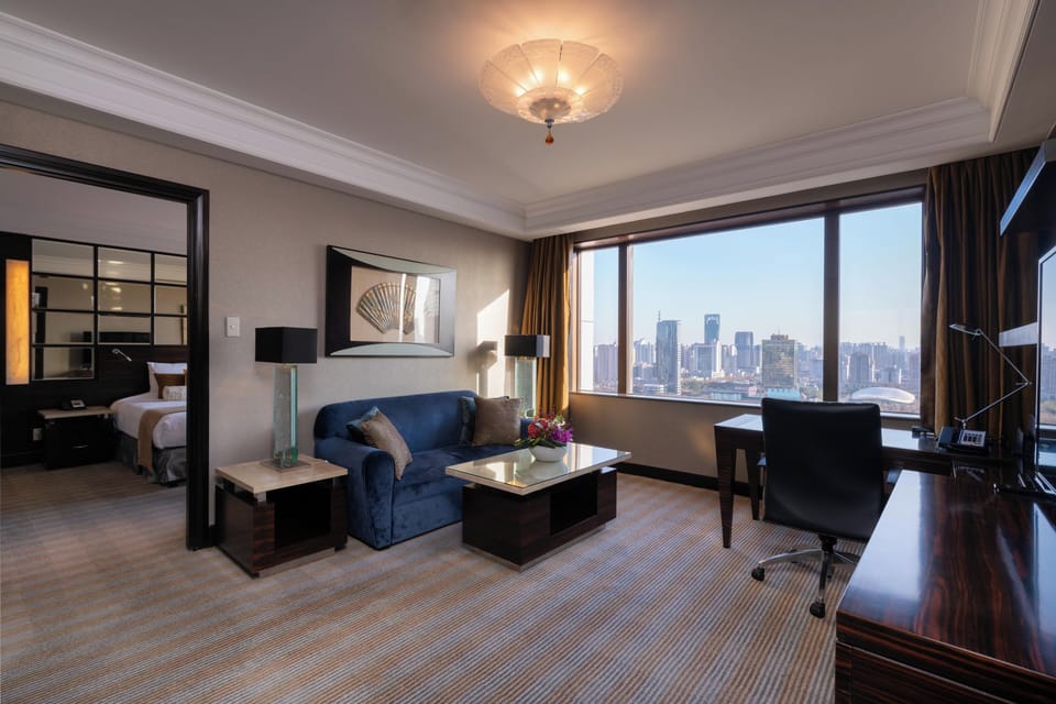 Superior Suite | Living area | 32-inch TV with satellite channels