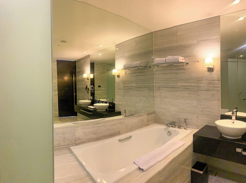 Junior Suite, 1 King Bed, Non Smoking, Air conditioning | Bathroom | Separate tub and shower, deep soaking tub, rainfall showerhead