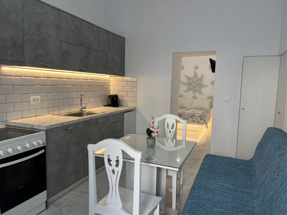Superior Double Room, Balcony, Ground Floor | Private kitchen | Fridge, electric kettle