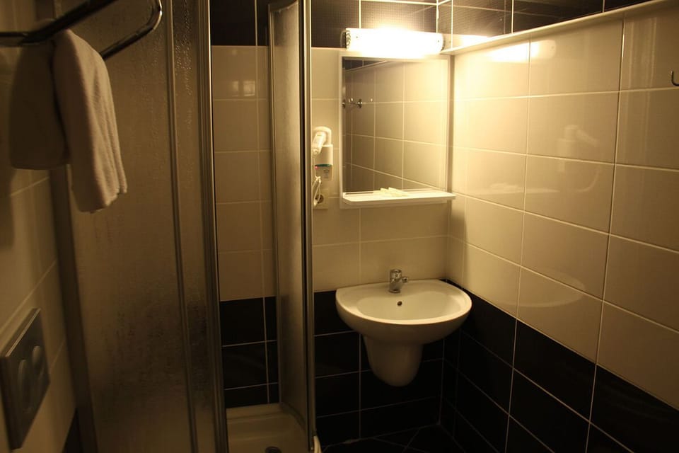 Shower, eco-friendly toiletries, hair dryer, slippers