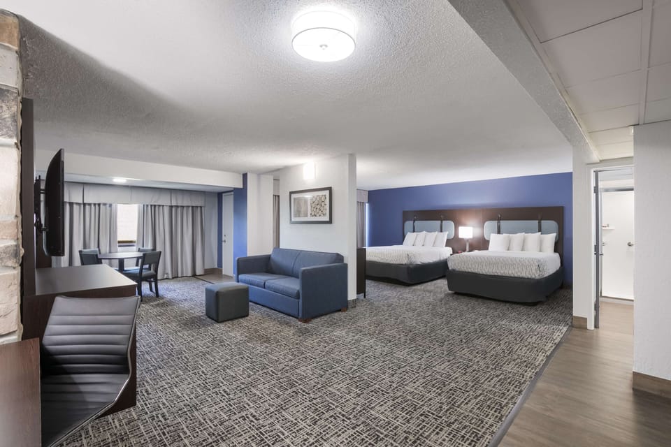 Suite, 2 Queen Beds, Balcony, River View (with Sofabed) | Desk, laptop workspace, blackout drapes, iron/ironing board