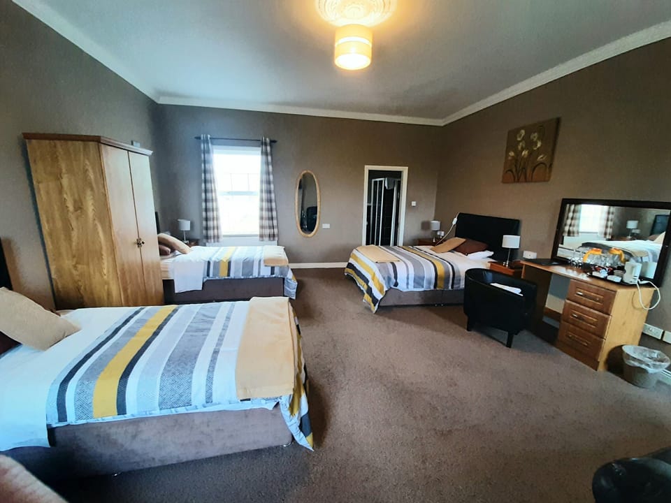 Family Room, Partial Sea View | In-room safe, desk, soundproofing, iron/ironing board (on request)