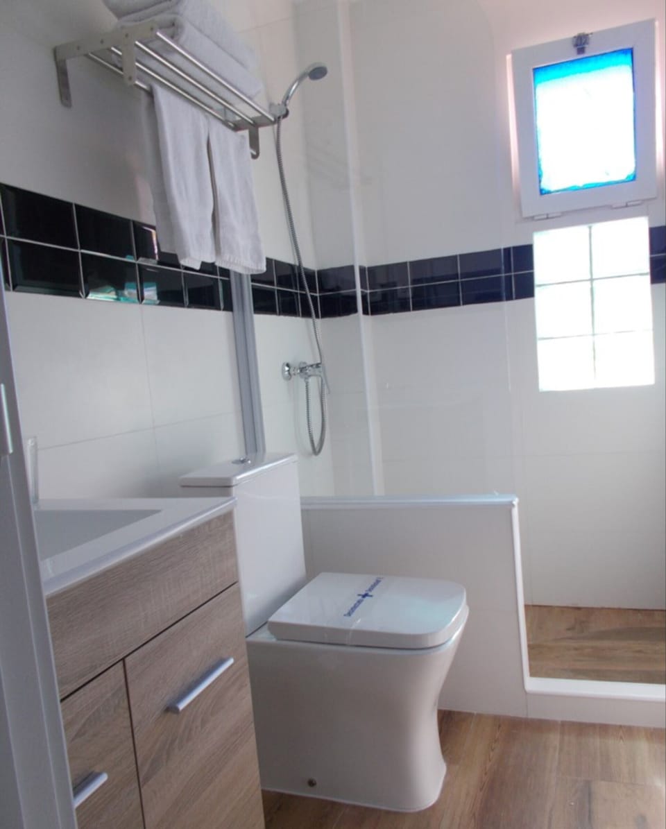 Shower, hydromassage showerhead, hair dryer, towels