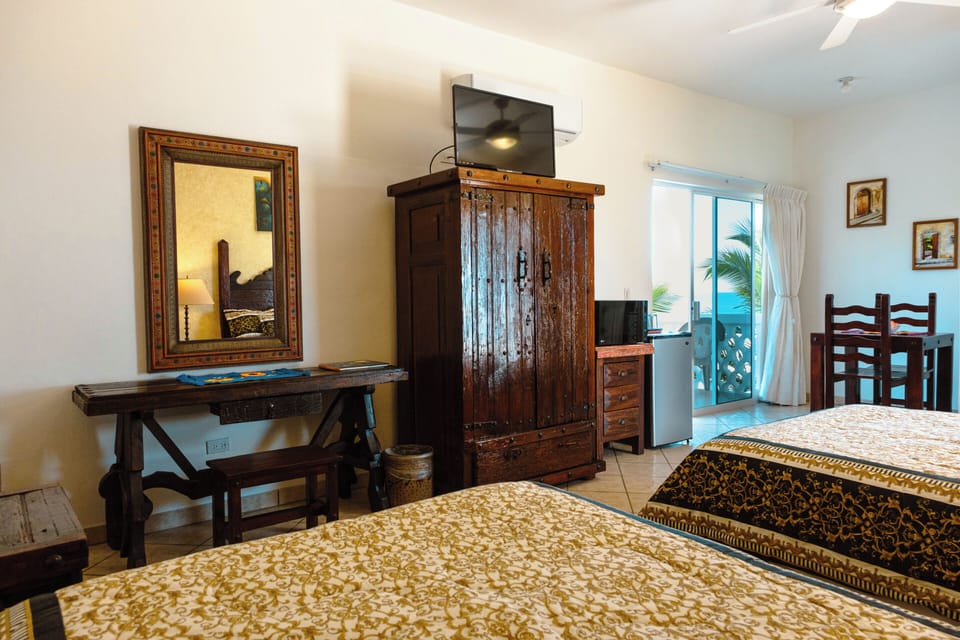 Standard Room, 2 Double Beds | Down comforters, minibar, in-room safe, individually decorated