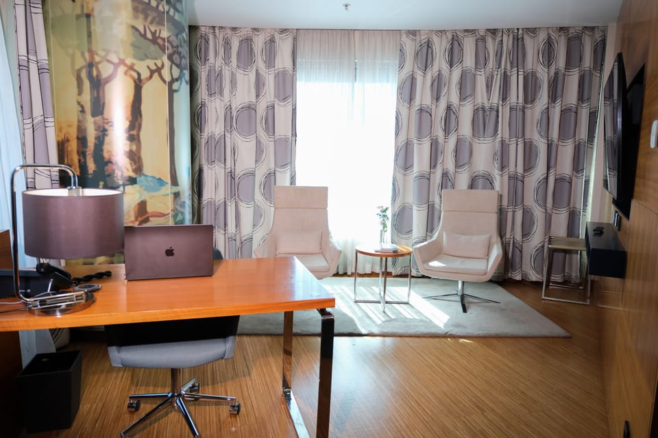 Deluxe Suite, 1 King Bed | Living area | LCD TV, fireplace