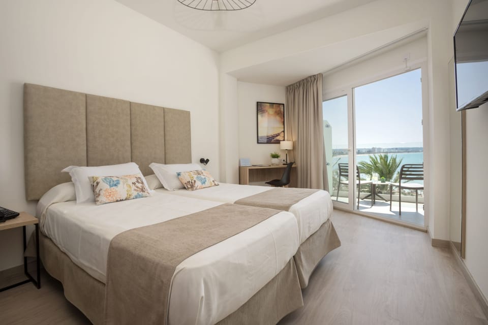 Double or Twin Room, Sea View | Minibar, desk, WiFi (free), bed sheets