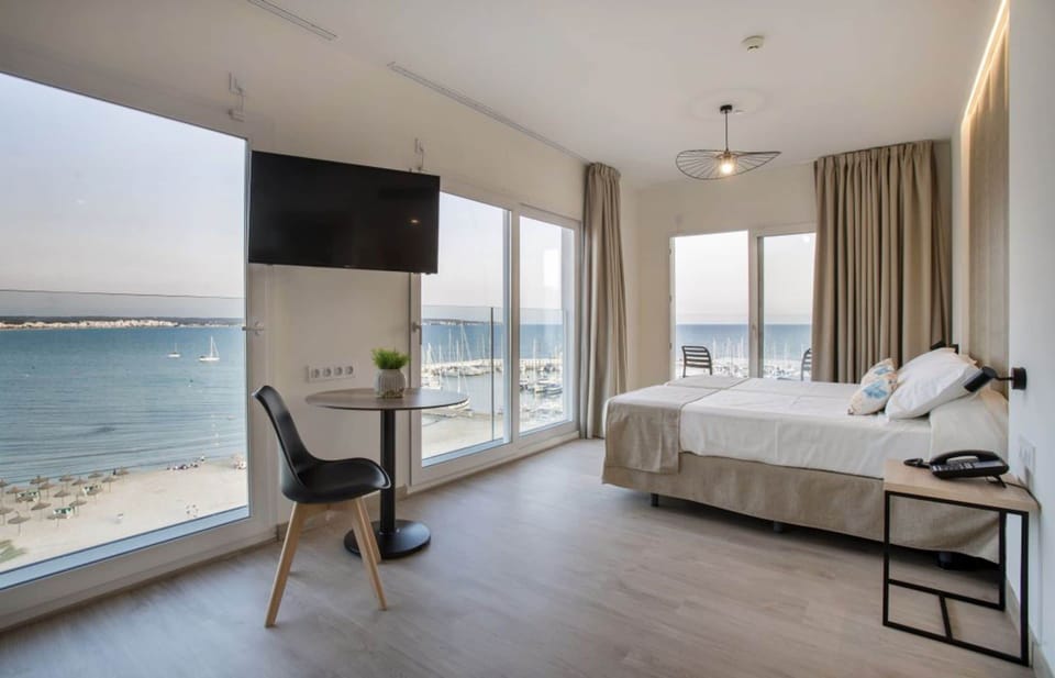 Junior Room, Sea View | Minibar, desk, WiFi (free), bed sheets