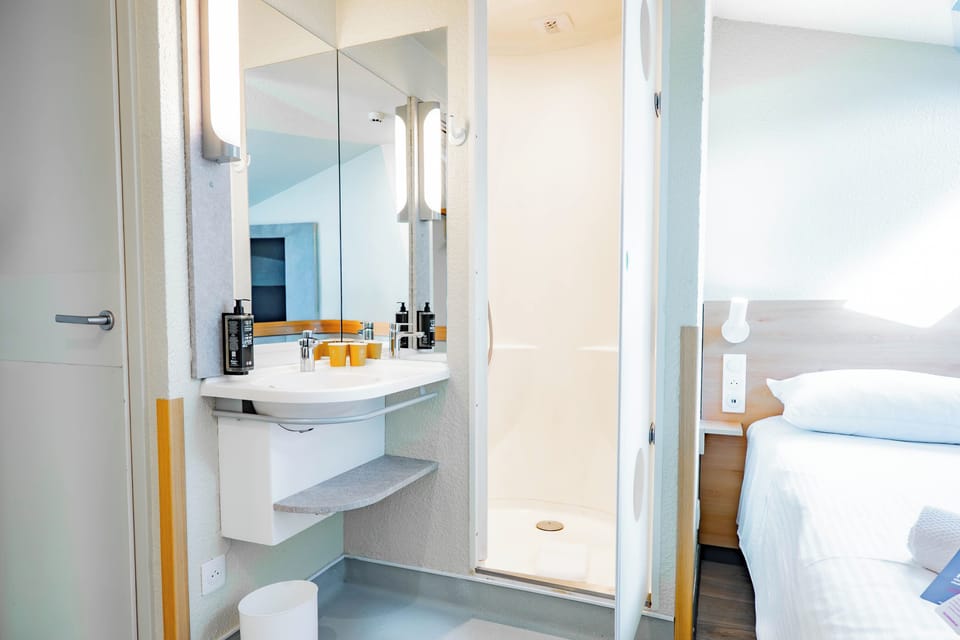 Double Room | Bathroom | Shower, eco-friendly toiletries, hair dryer (on request), towels