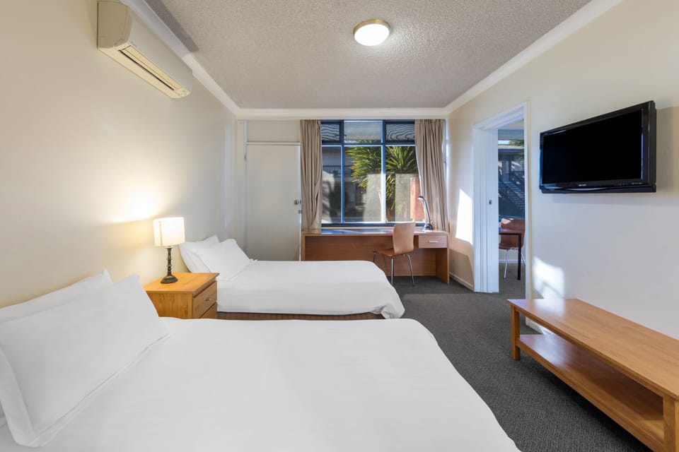 Family Suite, 2 Bedrooms, Non Smoking | Desk, iron/ironing board, free WiFi, bed sheets