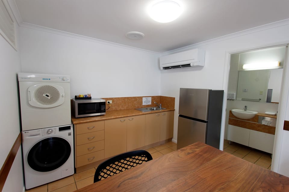 Suite, 1 Bedroom | Desk, laptop workspace, blackout drapes, iron/ironing board