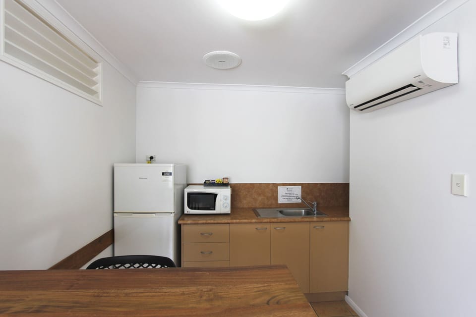 Suite, 1 Bedroom | Desk, laptop workspace, blackout drapes, iron/ironing board