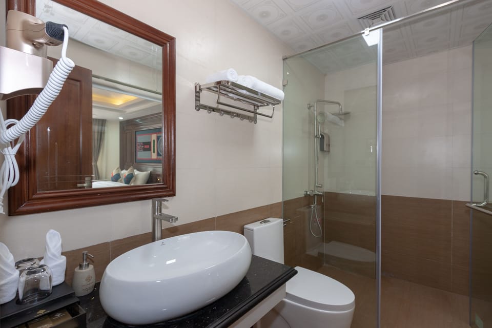Shower, designer toiletries, hair dryer, bathrobes