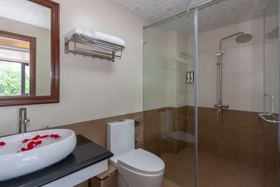 Shower, designer toiletries, hair dryer, bathrobes