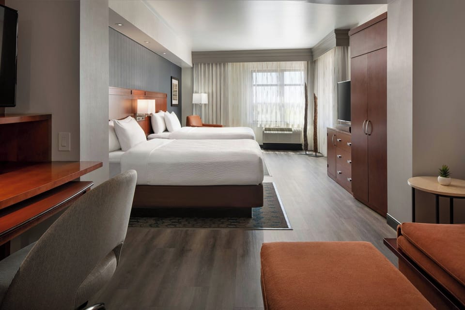 Junior Suite, Multiple Beds | Premium bedding, in-room safe, desk, iron/ironing board