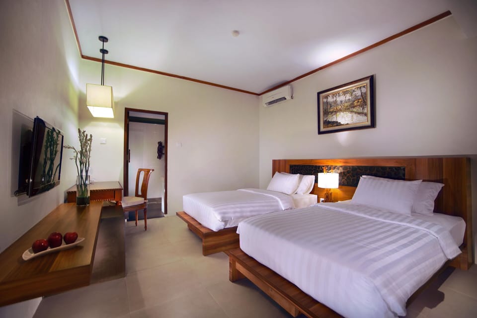 Deluxe Twin Room, Pool View | In-room safe, desk, laptop workspace, soundproofing