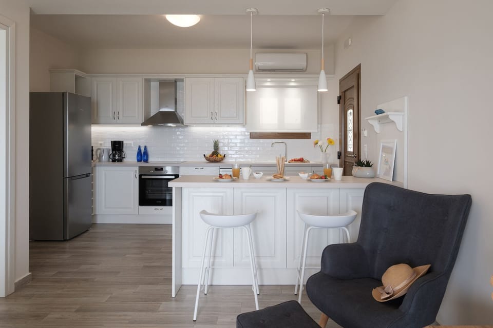Armikes Beachfront Suite 1 Afionas Kitchen And Dining Area 