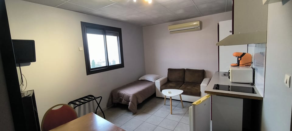 Comfort Apartment | Living area | 20-inch LED TV with cable channels, TV